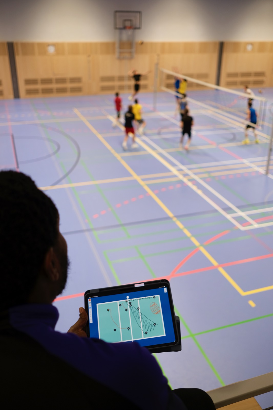 Coach using PiVolley on tablet courtside